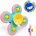 Baby playing with KyndCubs Suction Spinner on highchair tray — sensory mealtime toy